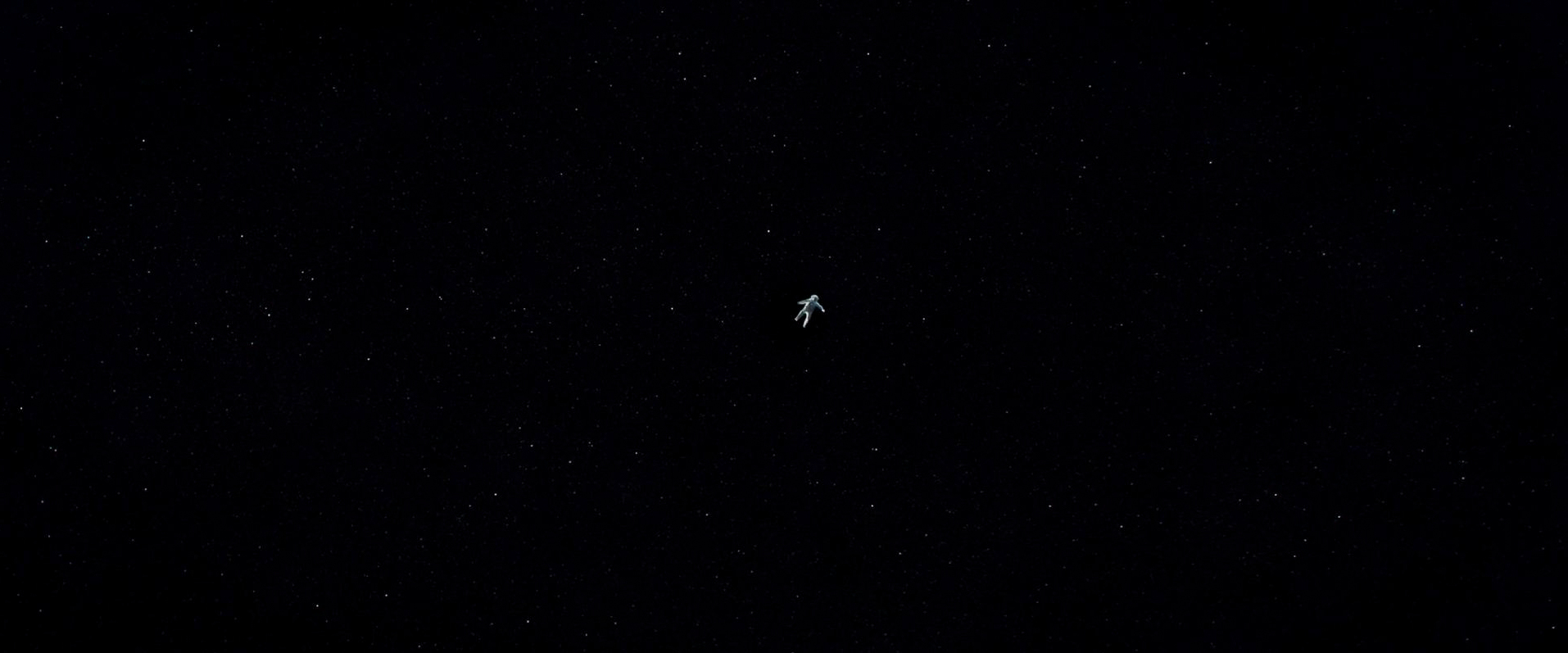 A single small astronaut figure drifts in the centre of a black, star-scattered frame